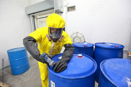 Photo: Professional in uniform dealing with chemicals Professional in uniform dealing with chemicals