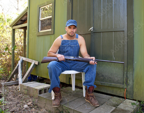 Photo: Man with Shotgun guarding his property Man with Shotgun guarding his property