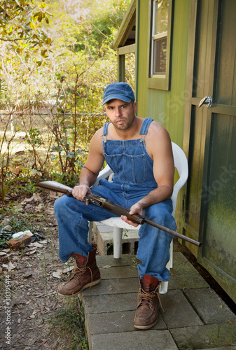 Photo: Country Man in Overalls with Shotgun Country Man in Overalls with Shotgun
