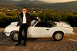 man with white convertible