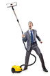 Vacuum cleaning by businessman on white