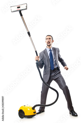 Photo: Vacuum cleaning by businessman on white Vacuum cleaning by businessman on white