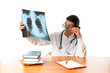 Male doctor looking at x-ray image