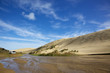 Dune Boarding at 90 Mile Beach on North Island, New Zealand.