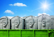 Garbage containers on blue sky background