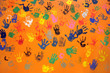 colored hand prints on orange wall colored hand prints on orange wall