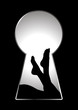 Silhouette of woman legs seen through a key hole