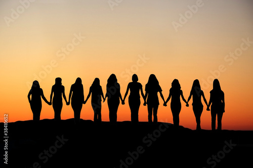 Photo: Woman friendship silhouette. Woman friendship silhouette.