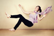 Young woman levitating