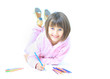 The beautiful girl drawing pencils in a sketch pad