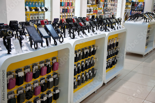 Photo: Digital cameras and mobil phones in store Digital cameras and mobil phones in store