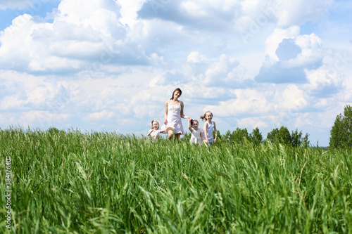 Photo: family with children in summer day outdoors family with children in summer day outdoors