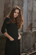 Portrait of young lonely woman thrusting hands into pockets Portrait of young lonely woman thrusting hands into pockets