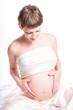 Portrait of a beautiful pregnant woman on white