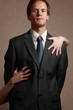 Man with women's hands on him