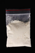 Cocaine in package on black background