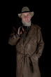 man with cowboy hat, long leather coat and riot gun