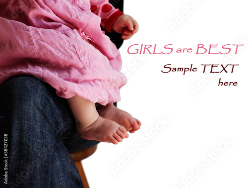 Photo: little girl in pink dress sitting on her mother's hands little girl in pink dress sitting on her mother's hands