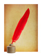 Red pen in the ink and old paper
