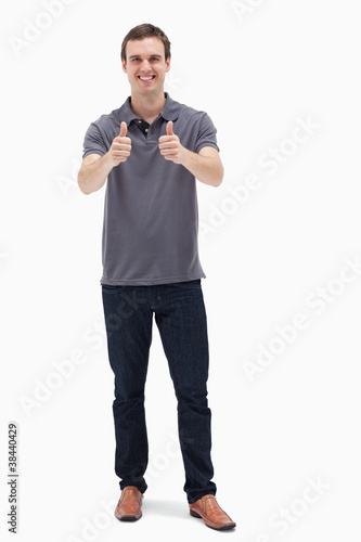 Photo: Man approving with his thumbs up Man approving with his thumbs up