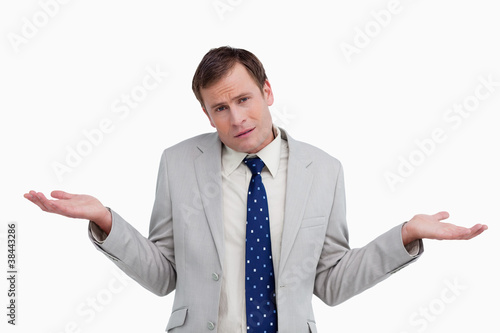 Photo: Close up of businessman having no idea Close up of businessman having no idea