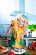 Blonde fashion funny on kitchen with pasta and Blonde fashion funny on kitchen with pasta and