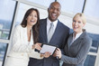 Businessman and Businesswomen Team Using Tablet Computer