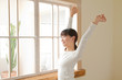 Photo: Beautiful young woman relaxing in the bedroom Beautiful young woman relaxing in the bedroom