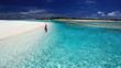 Young woman swimming in tropical lagoon
