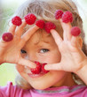 Photo: Little girl with raspberry Little girl with raspberry