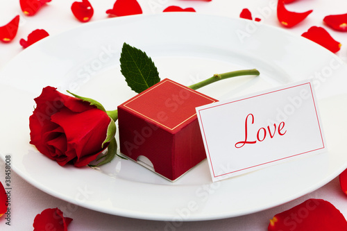 Photo: Red rose and engagement ring Red rose and engagement ring