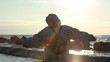 Back view of a person looking to the sea
