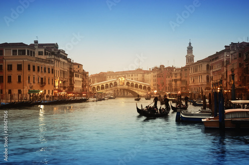 Photo: Rialto Bridge and gondolas in Venice. Rialto Bridge and gondolas in Venice.