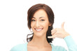 woman making a call me gesture
