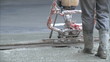 workers pour and align concrete floor