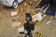 Take a photo of a crime scene with victim body on the ground