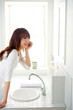 attractive asian woman in the bathroom