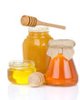 glass jar full of honey and stick glass jar full of honey and stick