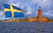 The city Hall. Stockholm. With flag of Sweden