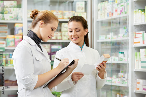 Photo: Pharmacy chemist women in drugstore Pharmacy chemist women in drugstore