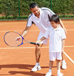 Father and son playing tennis