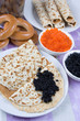 Pancakes with red and black caviar