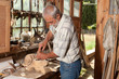 Old shed and skilled carpenter