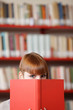Foto: Young student in a library Young student in a library