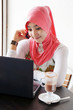 Young stylish muslim women talking on mobile phone infront of no