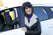 Woman driving her new car