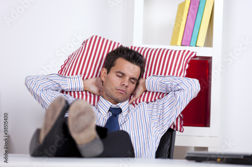 Photo: Businessman sleeping at the office Businessman sleeping at the office