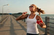 Beautiful woman in sunset light on a pier with watermelon heart