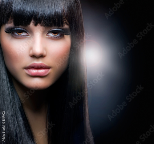 Photo: Fashion Brunette. Beautiful Makeup and Healthy Black Hair Fashion Brunette. Beautiful Makeup and Healthy Black Hair