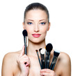 Woman with make-up brushes